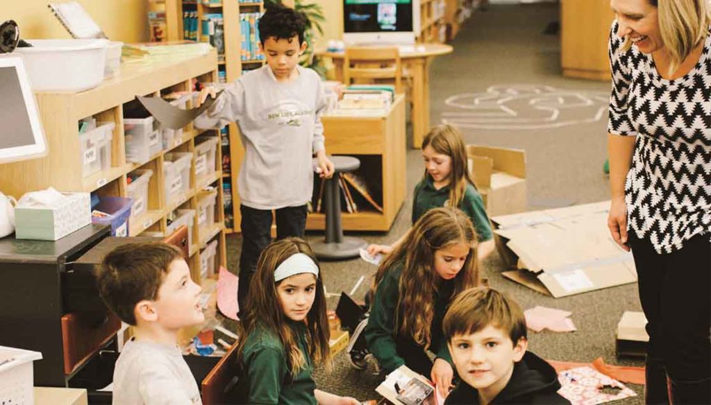 Elementary students collaborate on a hands-on STEAM project in the New Life Academy Makerspace.