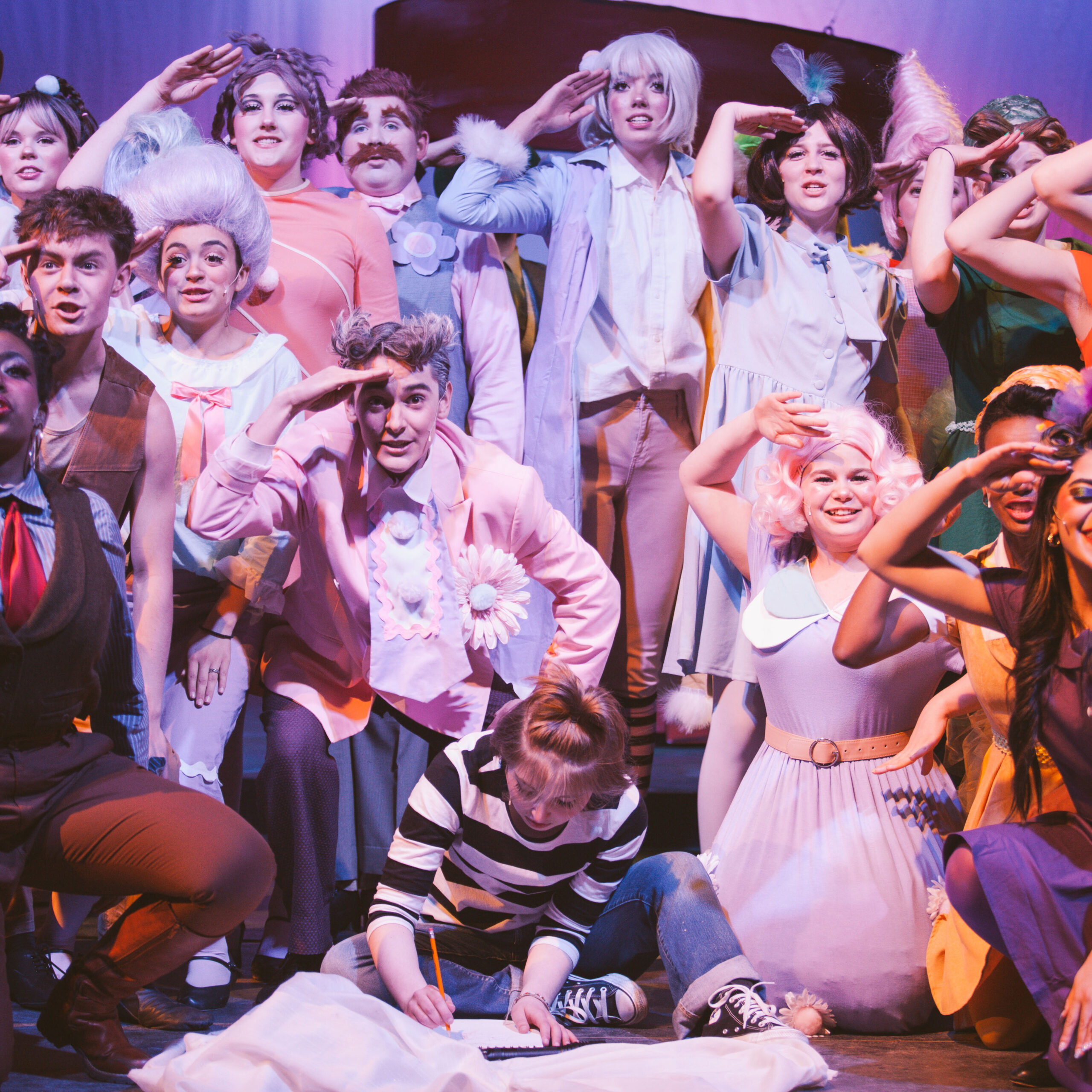 New Life Academy theatre cast performing an energetic ensemble scene in the school’s production of Seussical with colorful costumes and staged choreography.