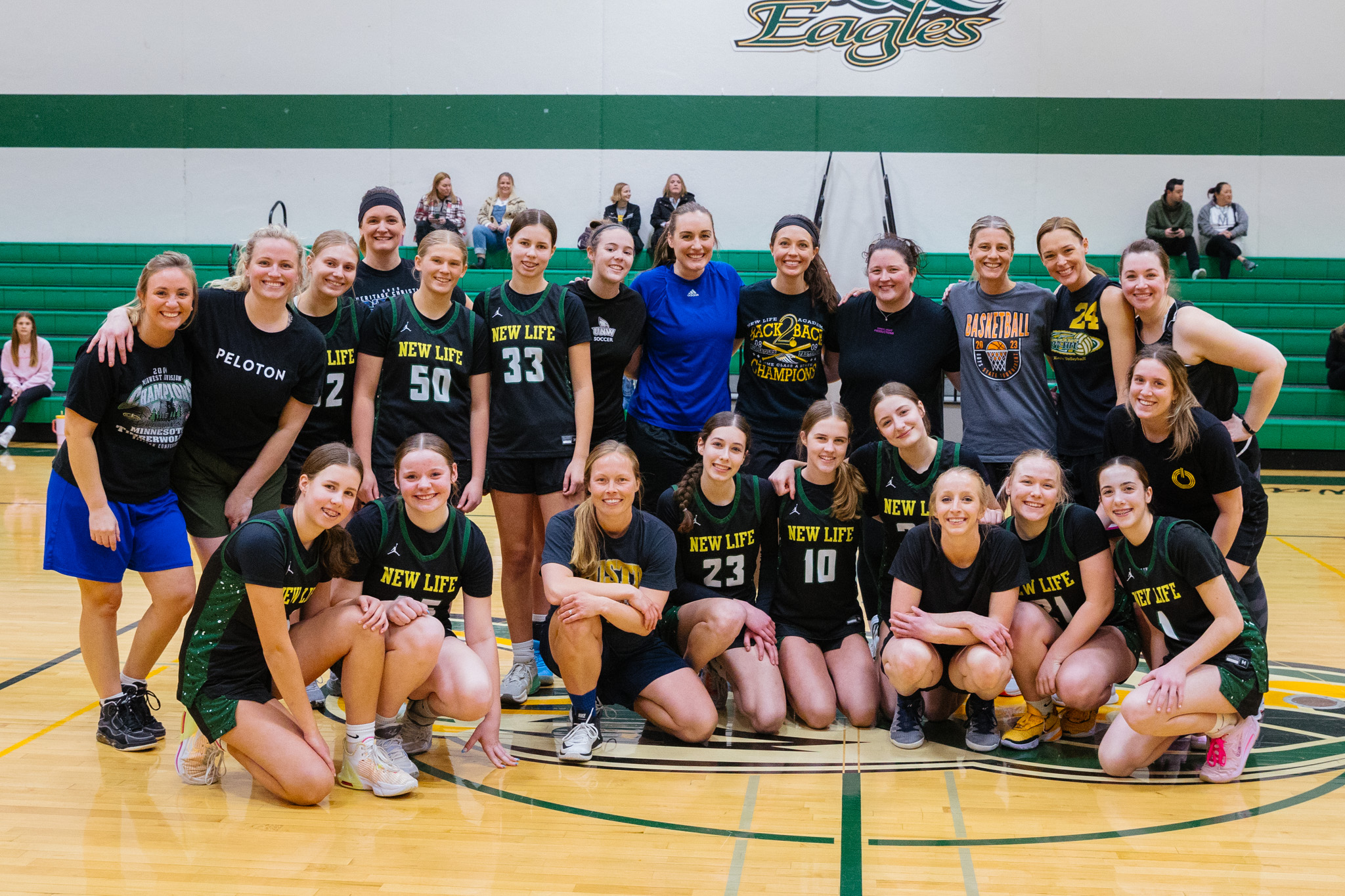 New Life Academy alumni and current players gathered on the gym court for the girls alumni basketball game.