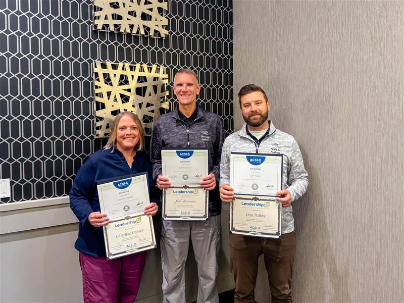 New Life Academy principals holding ACSI leadership licensure certificates after completing an intensive certification program.