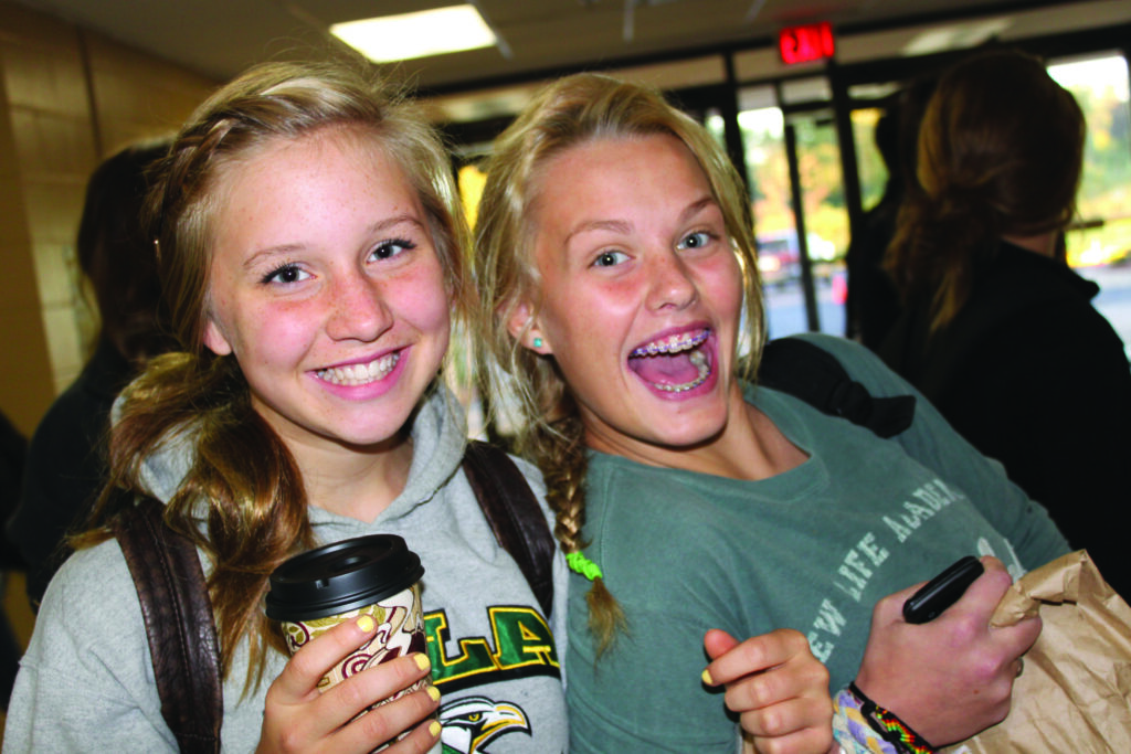 Students participate in New Life Academy's Buy A Cup, Build A Well (BACBAW) fundraiser, supporting clean water projects through coffee purchases.