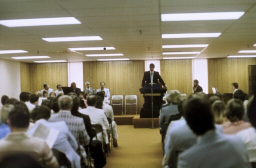 Congregation gathers for an early worship service at New Life Church, where Pastor Dick Wiens served as Senior Pastor during the church's early years.