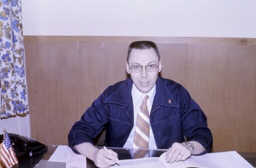 Dan Nordgren, New Life's first school administrator, at his desk during the school's early years.